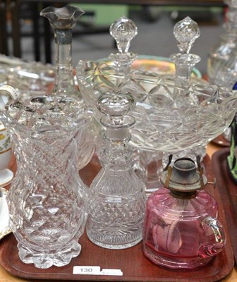 Lot 130 - A cut glass decanter with silver mount; a pair of cut glass decanters and stoppers; cut glass...