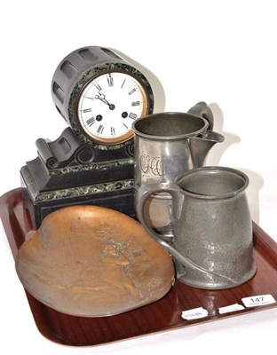 Lot 147 - A black slate mantel clock; an Art Nouveau style dish; a Tudric style pewter tankard; and another