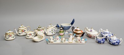 Lot 160 - A Collection of Miniature Porcelain Teapots...
