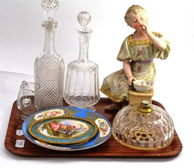 Lot 148 - A large Continental bisque figure of a seated girl; a Sevres blue and gilt decorated cabinet plate