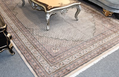 Lot 1124 - Indian Carpet, the ivory field with an allover...
