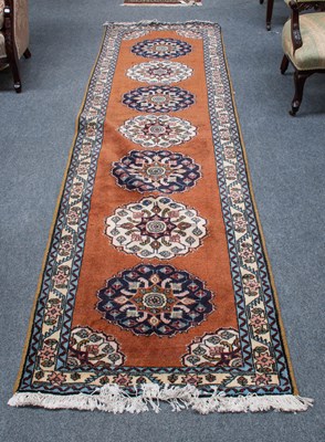 Lot 1117 - Ardabil Runner, the terracotta field with a...
