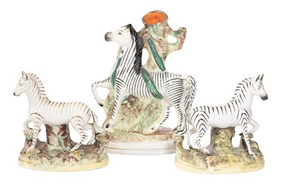 Lot 87 - A Matched Pair of Staffordshire Pottery Zebras,...