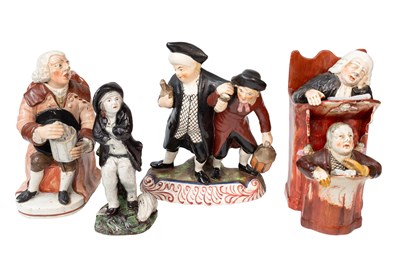 Lot 82 - A Staffordshire "Vicar & Moses" Figure Group,...