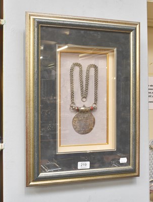 Lot 219 - A Framed Silver Omani Pendant on Chain, with...