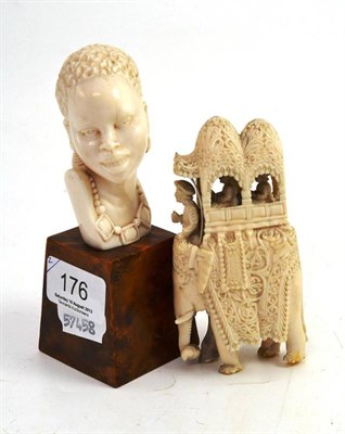 Lot 176 - An ivory elephant and howdah, an Indian African ivory bust on yew stand