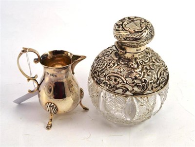 Lot 187 - Silver mounted cut glass scent bottle and a silver cream jug