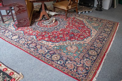 Lot 1322 - Tabriz Carpet, the blood red field centred by...