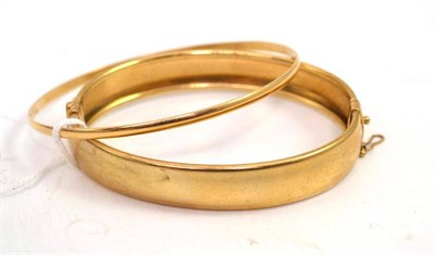 Lot 203 - Two 9ct gold bangles