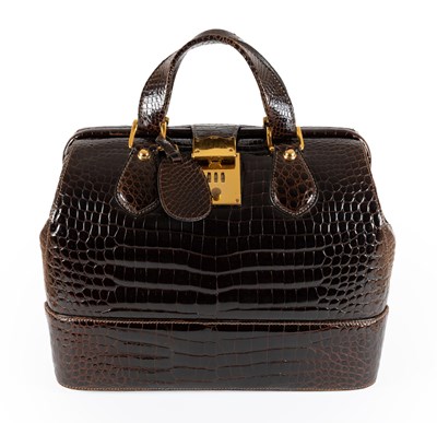 Lot 1053 - A 1968 Gucci Crocodile Skin Brown Vanity Case,...