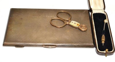 Lot 217 - A silver cigarette case, a stick pin and cigar cutter