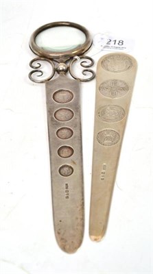 Lot 218 - Two silver paper knives set with coins