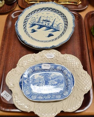 Lot 242 - A saltglaze press moulded dish (damaged), a Leeds blue and white sauce tureen stand, another...