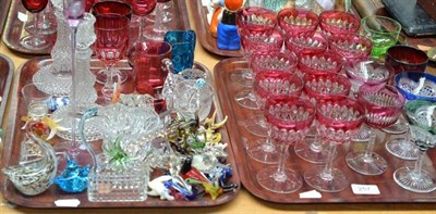 Lot 257 - Twelve cut cranberry glasses, a pair of press moulded candle sticks, glass animal ornaments etc