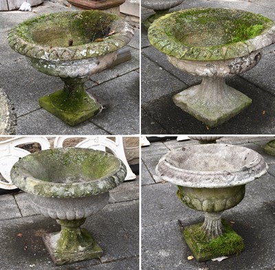 Lot 242 - Four Similar Composition Stone Garden Urns,...