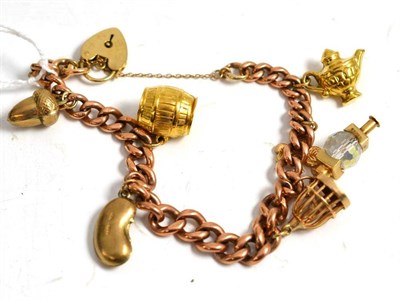 Lot 267 - Gold charm bracelet in a hinged purse