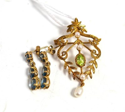 Lot 288 - A 9ct gold peridot set brooch/pendant and a pair of drop earrings