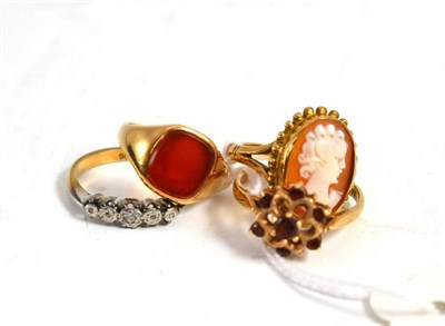 Lot 290 - A 9ct gold Cornelian ring, a cameo ring, a five stone ring and a cluster ring