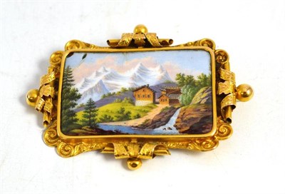 Lot 295 - A yellow metal brooch with an inset painted porcelain plaque in fitted case