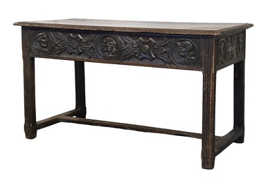 Lot 497 - A Carved Oak Side Table, the planked top of...