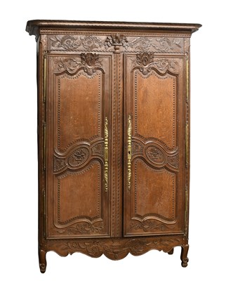 Lot 668 - A French Carved Oak Armoire, late 18th century,...