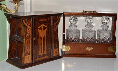 Lot 327 - An Art Nouveau smoker's cabinet and a three bottle tantalus