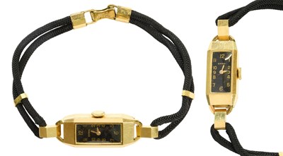 Lot 440 - A Lady's 18 Carat Gold Cyma Wristwatch, manual...
