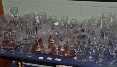 Lot 373 - A shelf of assorted 19th century and later drinking glasses with etched and cut designs