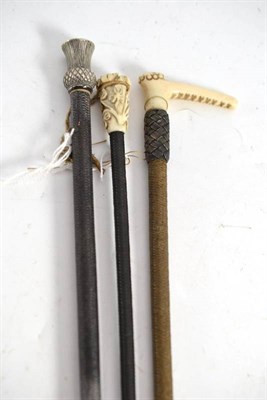 Lot 376 - Three lady's riding crops with ivory and silver thistle