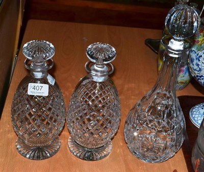 Lot 407 - A pair of decanters and stoppers and another (3)