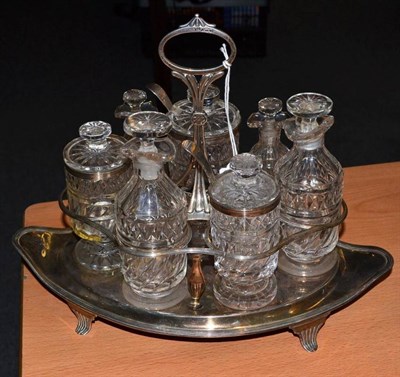 Lot 408 - A George III silver cruet stand, John Emes, London 1802, of navette form, engraved with cursive...