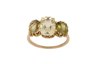 Lot 2028 - A Sapphire and Chrysoberyl Three Stone Ring...