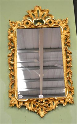 Lot 493 - A modern gilt framed decorative mirror in a pierced frame