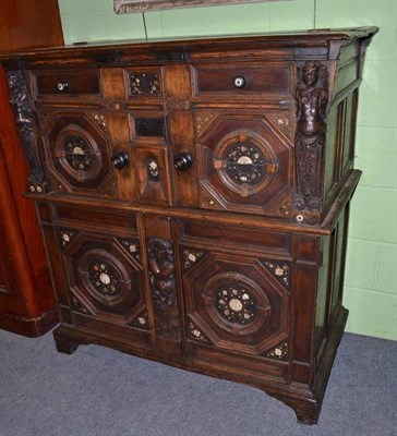 Lot 500 - A 17th century oak and snake wood cupboard, later adapted, width 118cm