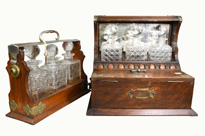 Lot 248 - A 1920s Oak Three Bottle Tantalus, with silver...