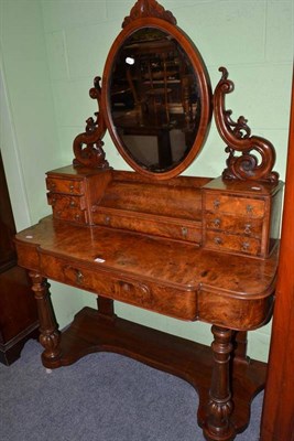 Lot 502 - A Victorian walnut duchess dressing table