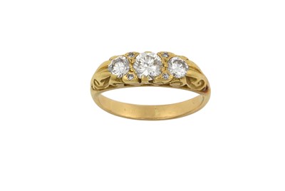 Lot 2046 - A Diamond Three Stone Ring the graduated round...