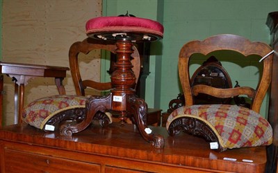 Lot 514 - A Victorian walnut revolving piano stool, height 46cm and a pair of Victorian footstools