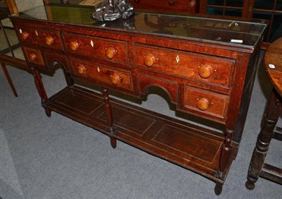 Lot 518 - An oak dresser base and glass protector