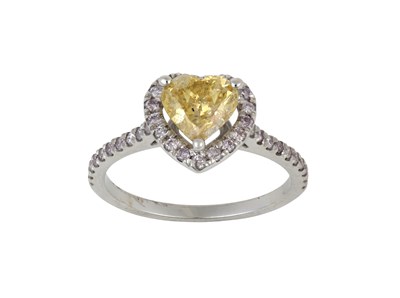 Lot 2008 - A Fancy Coloured Diamond Cluster Ring the...