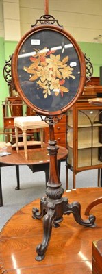 Lot 526 - A Victorian rosewood pole screen with woolwork insert