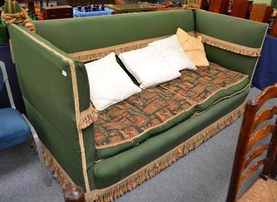 Lot 536 - A green upholstered Knoll style drop end settee