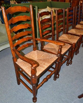 Lot 538 - A set of six rush seated ladder back chairs