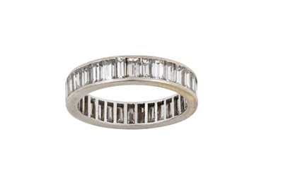 Lot 2108 - A Diamond Eternity Ring thirty-two baguette...