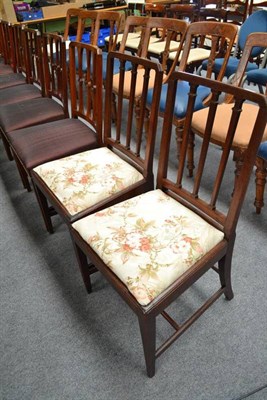 Lot 550 - A harlequin set of eight dining chairs