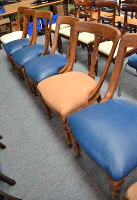 Lot 551 - A composite set of eight oak spoon back dining chairs