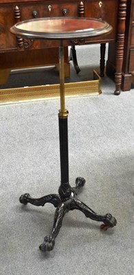 Lot 560 - A Victorian adjustable barber's stand with brass capped cast iron base, brass stem and circular...