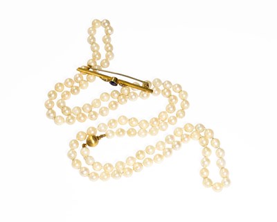 Lot 482 - A Synthetic Sapphire and Split Pearl Bar...