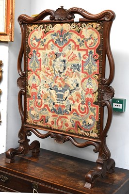 Lot 1318 - A Victorian Carved Walnut Firescreen, with...