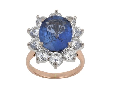 Lot 2069 - A Sapphire and Diamond Cluster Ring the oval...